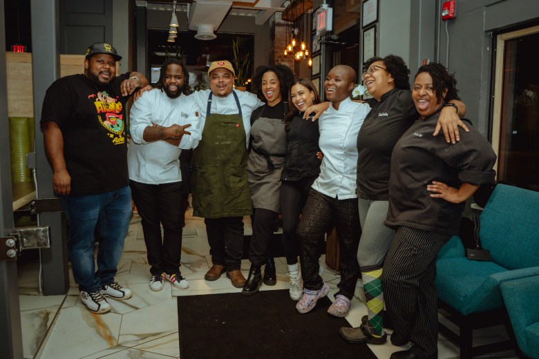 Chefs Gary Caldwell. Rodney Smith, Robert Butts, Jon'nae "Jaye" Harris, Christan Willis, India Johnson, and Dene Lynn at stand arm and arm after The New South dinner at Auburn Angel in Atlanta.