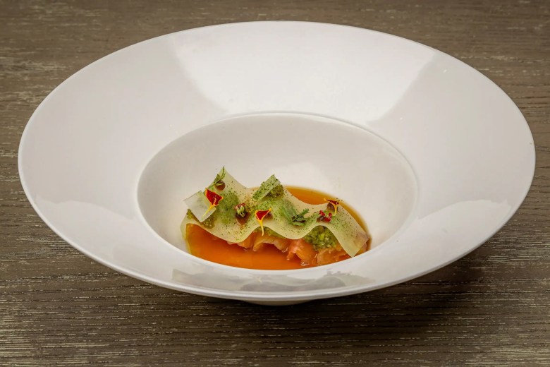 a white bowl of North Georgia mountain trout cru from Avize in Atlanta.