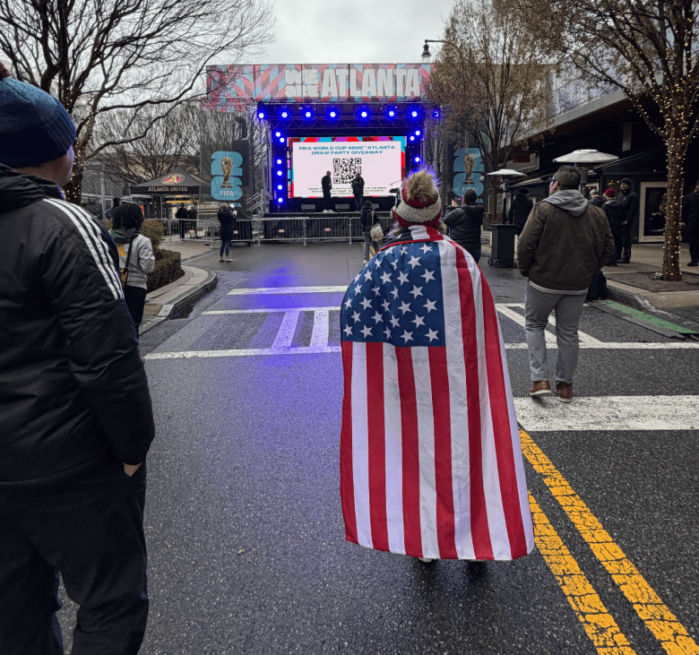 Soccer Fans approach the stage in advance of the World Cup Drawing event.