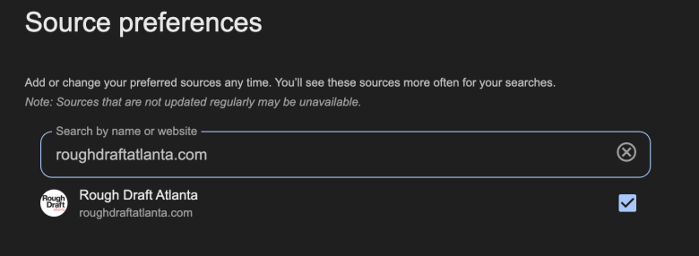 Screenshot of a “Source preferences” settings page with a dark background. The text explains that users can add or change preferred sources for searches. In the search bar, “roughdraftatlanta.com” is entered, and below it, the Rough Draft Atlanta logo with the site name and URL is shown. A blue checkmark box is selected on the right.