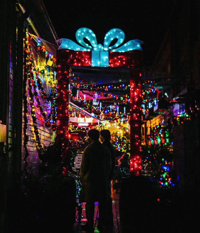 The alleyway entrance  lit up with Christmas lights to Tiki Holiday in Decatur. (Via S.O.S Tiki Bar/Instagram) 